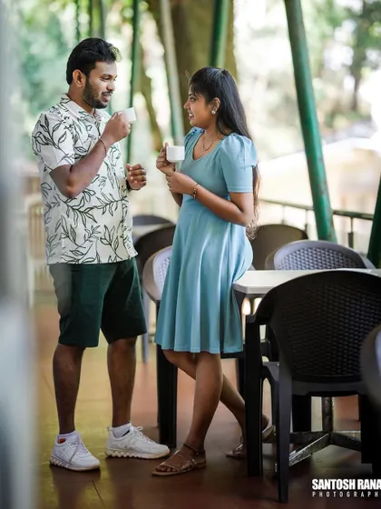 A full shot of a couple enjoying their coffee date, capturing a casual and realistic moment.