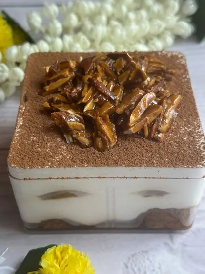 My Coffee Rasgulla Tiramisu Tub is a unique Diwali special. It layers coffee-soaked rasgullas with creamy mascarpone and a crunchy almond praline topping for a delightful fusion of flavors and textures.