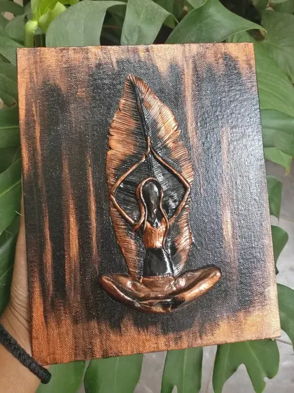 This is a mural painting on canvas depicting a figure in a yoga pose. The metallic bronze finish and leaf-inspired design connect the themes of spirituality and nature.