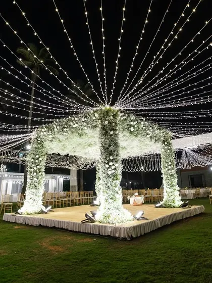A breathtaking mandap under a canopy of baby's breath and a sky of twinkling fairy lights. This is where I transform venues into ethereal dreamscapes for your most sacred moments.