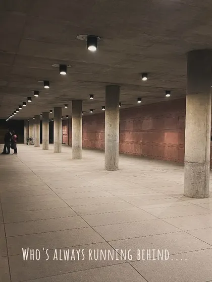 A wider view of the underpass, showing me still working to get the shot. The text overlay continues the story of a photographer's dedication.