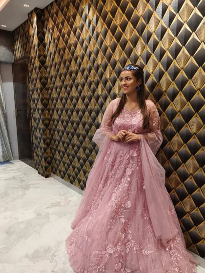 A candid shot of the client in the pink gown.