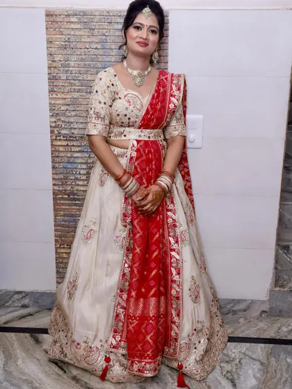 A full-length view of her gorgeous traditional outfit, perfect for a wedding celebration.