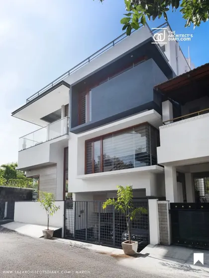 An alternate angle of the Cube House exterior, showing the interplay of stacked volumes and the cantilevered terrace.
