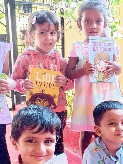Children posing with their chosen books.