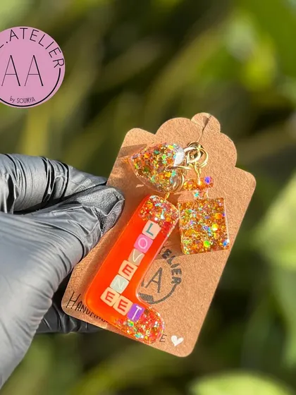 A custom keychain with a heart and square charm. These make for thoughtful and personal gifts that people use every day.