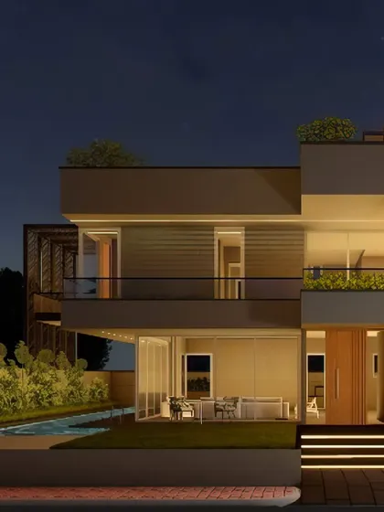 The residence transforms at night with a carefully planned ambient lighting scheme. The lights highlight the multi-tiered geometry, the warmth of the interior spaces visible through full-height windows, and the tranquil poolside area.