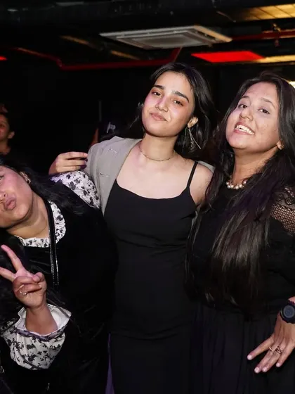 Guests posing for a photo during a fun night out.
