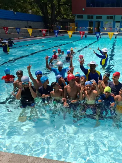 The joy and excitement of our summer camp swimmers celebrating a great day in the pool.