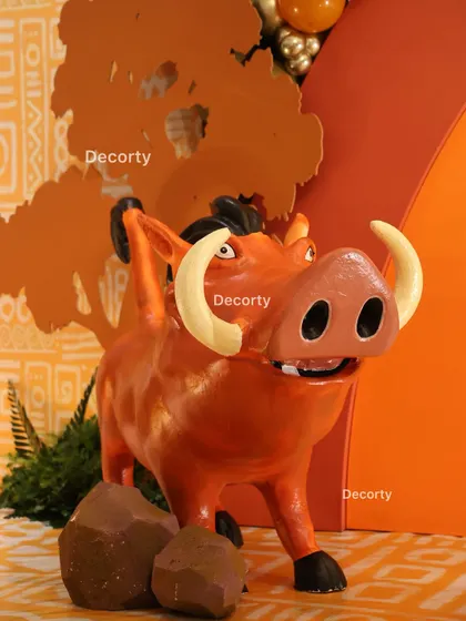 A close-up of the detailed Pumbaa prop, showcasing the quality and craftsmanship of the decor elements I use.
