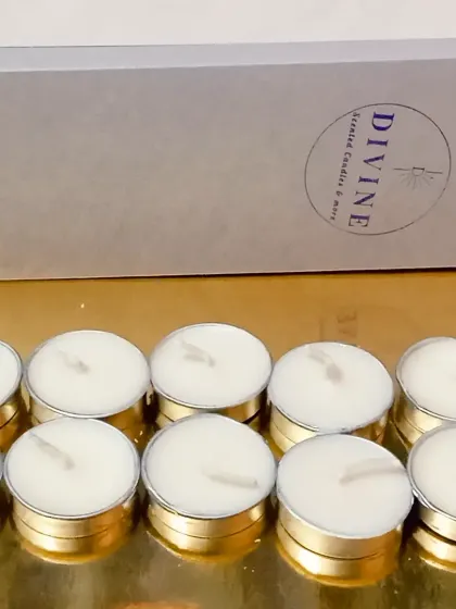 Another view of the tealight pack. Please note the tealight containers are silver aluminum; the gold color is just a reflection from the table.