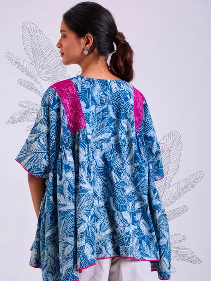 The back of our Chaaya oversized top, showing its generous, flowing silhouette. This piece is designed for comfort and ease, perfect for a relaxed day.