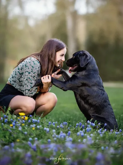 The beautiful friendship between kids and their pets is my favorite thing to capture. This sweet moment between a girl and her black lab in a field of bluebells is priceless.