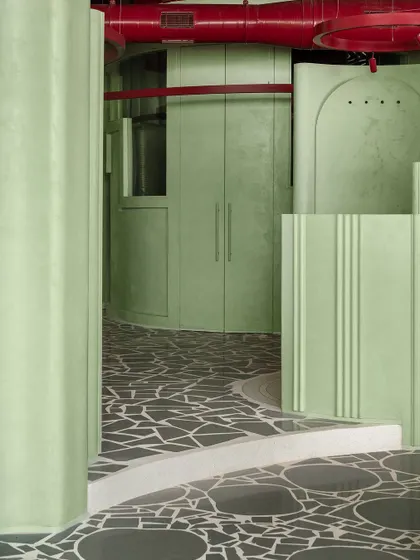 A view down a corridor in the 'Sorbet' retail space, where our patterned terrazzo floor acts as a visual pathway, guiding customers through the store.
