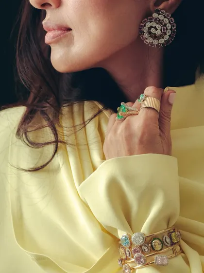 There’s something irresistible about the way soft pastels meet a burst of candy shades. The playful, coloured gems of the bracelets and bold statement rings come together like sweets in a box.