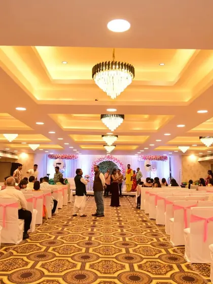 Another shot from a live event at Jashan banquet, showing guests seated and watching the ceremony. The hall's lighting and ambiance are perfect for celebrations.