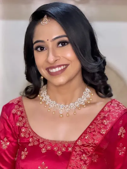 Vidhya's gorgeous reception look. A classic smokey eye paired with a neutral brown lip is always a timeless and elegant choice for an evening event.