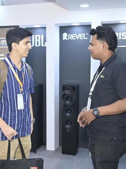 A one-on-one consultation at our booth, showcasing products from JBL and Revel. We provide a space for detailed conversations, helping clients find the perfect audio solutions for their projects.
