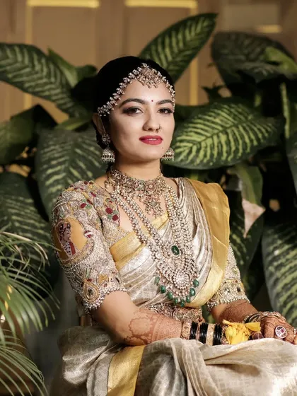 This look is pure royalty. The makeup is glamorous and defined, perfectly suited for the heavily embroidered blouse and traditional jewelry. A key style you will learn for grand muhurtham ceremonies.