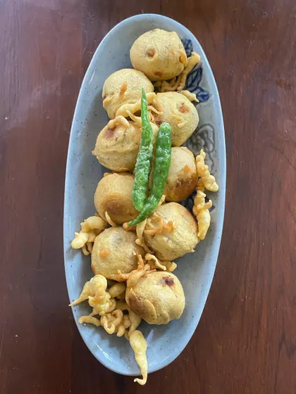 A top view of the Mini Vadas. These small, round fritters are made from a lentil batter and are a popular South Indian tea time snack.