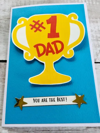 Another angle of our popular "#1 Dad" trophy card, showing the clean design and heartfelt message.