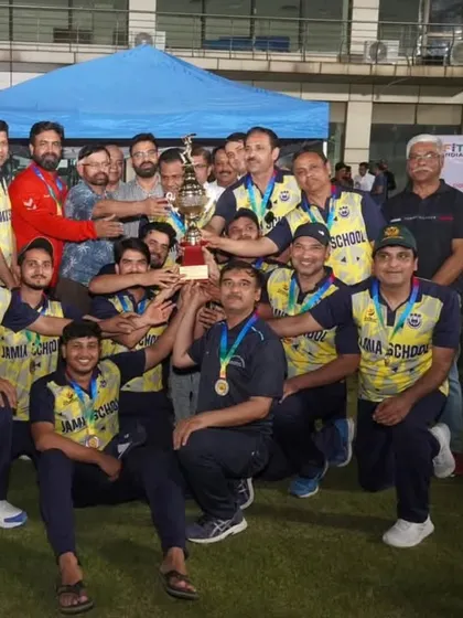 The pure joy of winning. The Jamia School team celebrates with the trophy after the conclusion of the Jamia Premier League T-20 staff tournament. For me, it's all about creating these moments of shared success and team spirit.