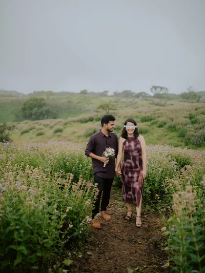 A wide shot capturing the expansive and beautiful landscape during a pre-wedding photoshoot in the hills.