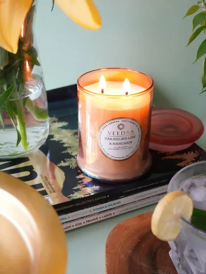 The refreshing glow of our Darjeeling Lime & Mandarin candle. This two-wick candle, set in a beautiful glass jar, brings a zesty and uplifting energy to your space, perfect for a bright afternoon.