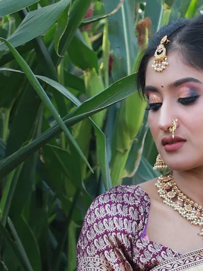 A close-up view highlighting the brocade blouse and traditional jewelry that complements this Langa Voni.