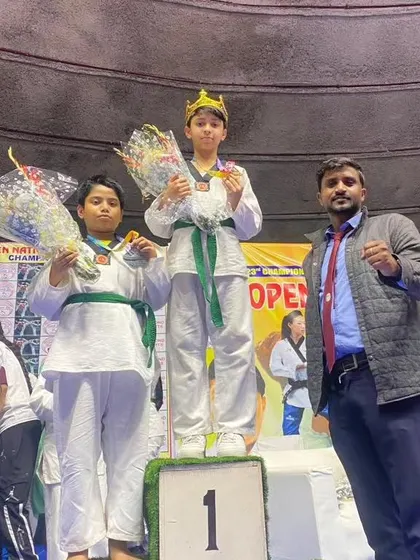 My student on top of the podium, celebrating his gold medal win.