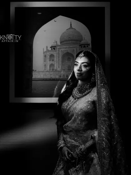 An iconic black and white bridal portrait with the Taj Mahal in the background. We are skilled at creating unique and symbolic images.