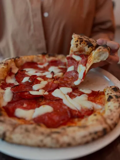 Dive into pizza perfection with this slice of classic pepperoni.
