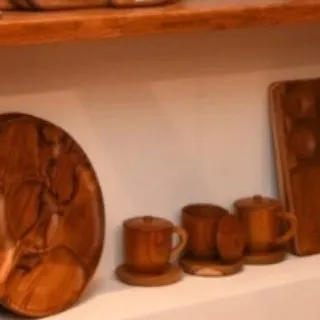 A collection of my lidded teak cups and saucers, perfect for serving tea or coffee. These pieces bring the warmth and natural elegance of wood to your table.