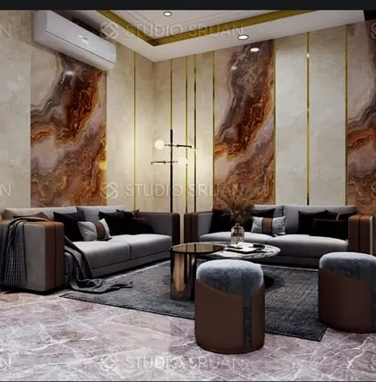 A luxurious lobby in DLF, Gurgaon, featuring dramatic, book-matched marble panels on the wall, accented with brass strips for a touch of opulence.