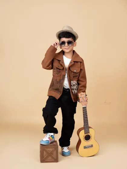 Adjusting his shades like a pro. We love it when kids bring their own personality and poses to the shoot.