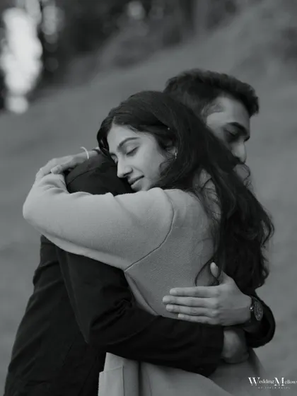 A beautiful black and white portrait of a comforting hug. The image focuses on the emotion and security found in the embrace, creating a timeless and heartfelt photo.