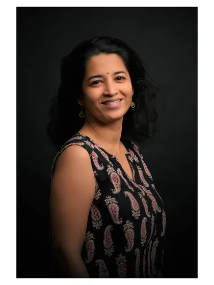 A variation of the studio portrait, showcasing a natural and engaging smile.