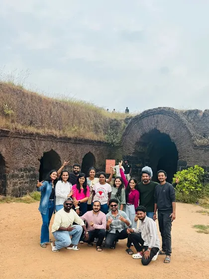 Trekking with me is about making memories with great people. Here's one of my happy groups after a rewarding climb at Kumaraparvatha, posing by the historic fort structure on the trail.