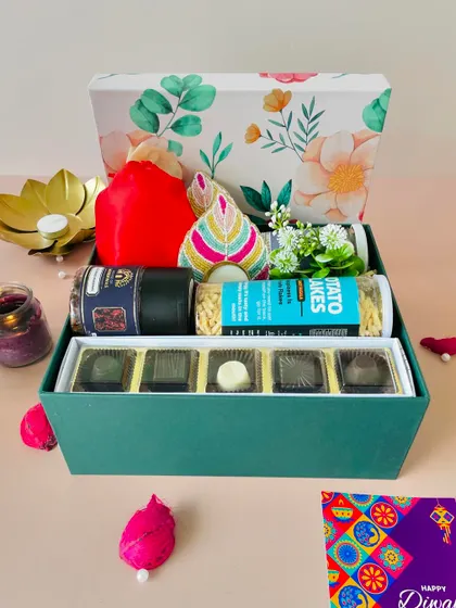 The same floral box from a different angle, showing the "Happy Diwali" card and the beautiful presentation.