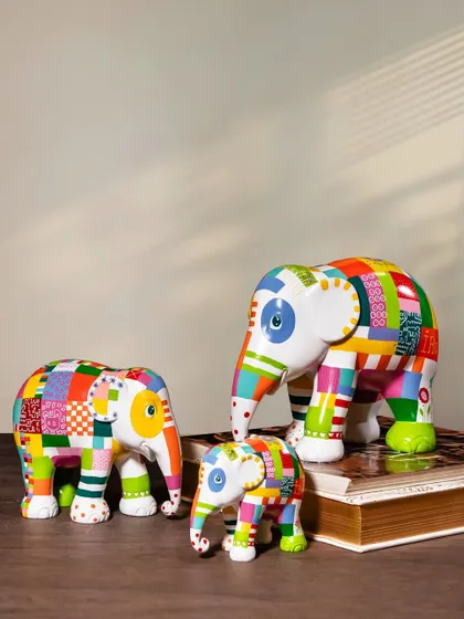 The "Elmer" family of sculptures, crafted from high-quality polyresin to preserve the intricate artistic details. Owning a piece from the Elephant Parade means you are part of a global movement merging art with impact.