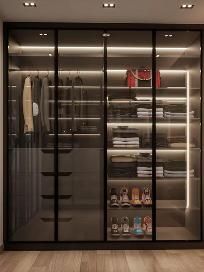 This is the 'His' side of the same walk-in closet, with custom shelving for sneakers and folded items. The design proves that you don't need a huge room to have a dreamy, organized closet.