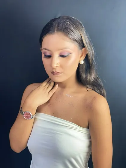A closed-eye shot showing the soft pink airbrushed eyeshadow, a difficult technique that our students master through practice.