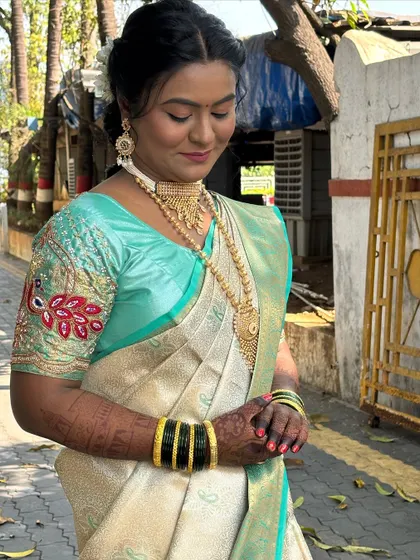 A candid shot of the bride outdoors, showing how the makeup looks in daylight.