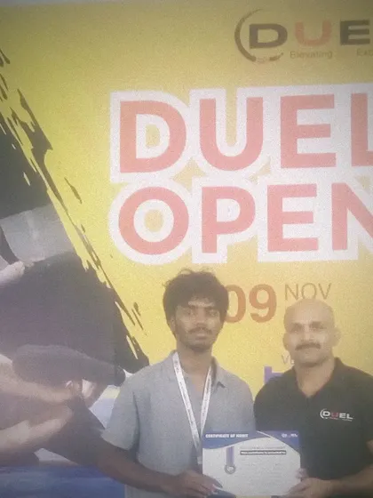 Dhanush receiving his certificate and silver medal at the DUEL Open. We ensure our fighters compete regularly to build their experience on the mats and in the cage.