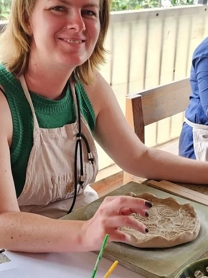 A few snapshots of corporate team members completely absorbed in their creative process. They are making everything from decorative nameplates to unique bowls during our hand-building workshop.