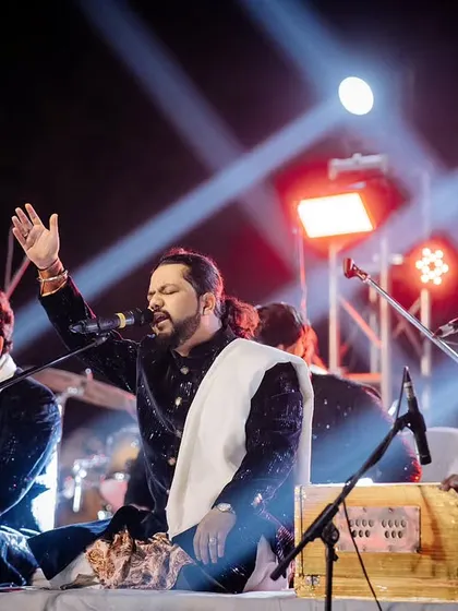 A powerful shot of the Nizami Brothers mid-performance, capturing the passion and energy of their live Sufi music.