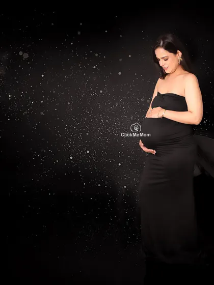A universe of love within. This portrait uses a starry night background to create a cosmic and magical feel, symbolizing the universe of love a mother holds for her unborn child.