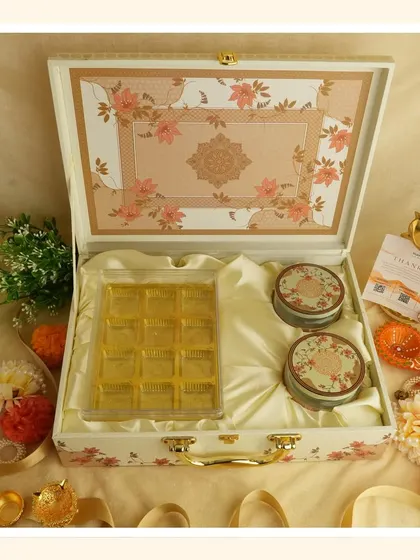 Another view of the "White Bliss" hamper, showing the contents and the elegant floral design on the inside of the lid.