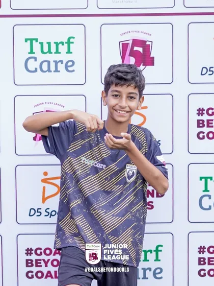 A player shows off his personality in front of the J5L backdrop. I encourage my athletes to be confident and have fun while they compete.