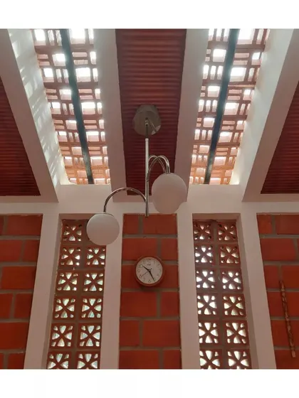 A close-up of the jaali windows and skylight, showing how different openings work together to create a light-filled interior.